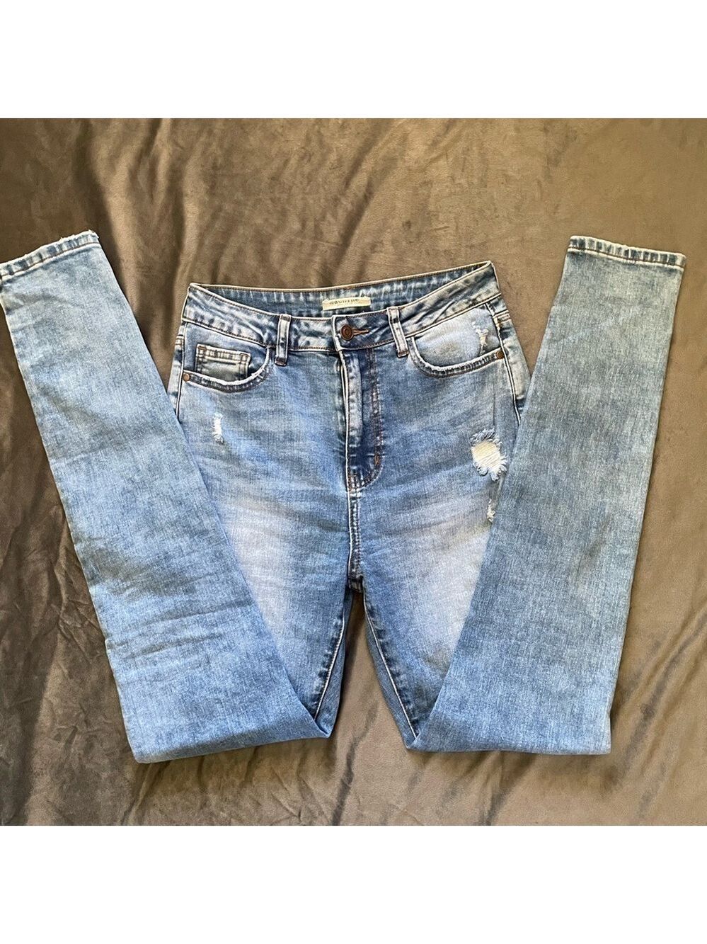 Machine distressed high-rise skinny jeans